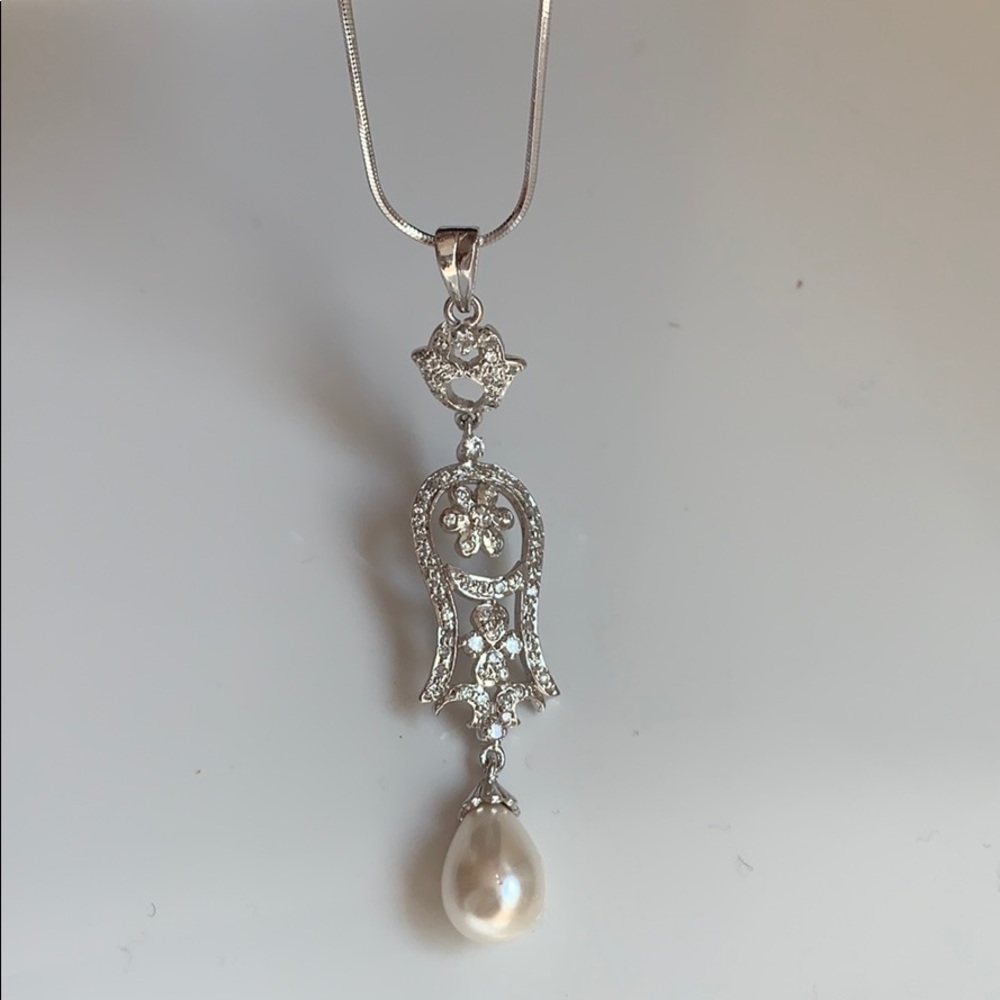 Silver pendent and earring set.